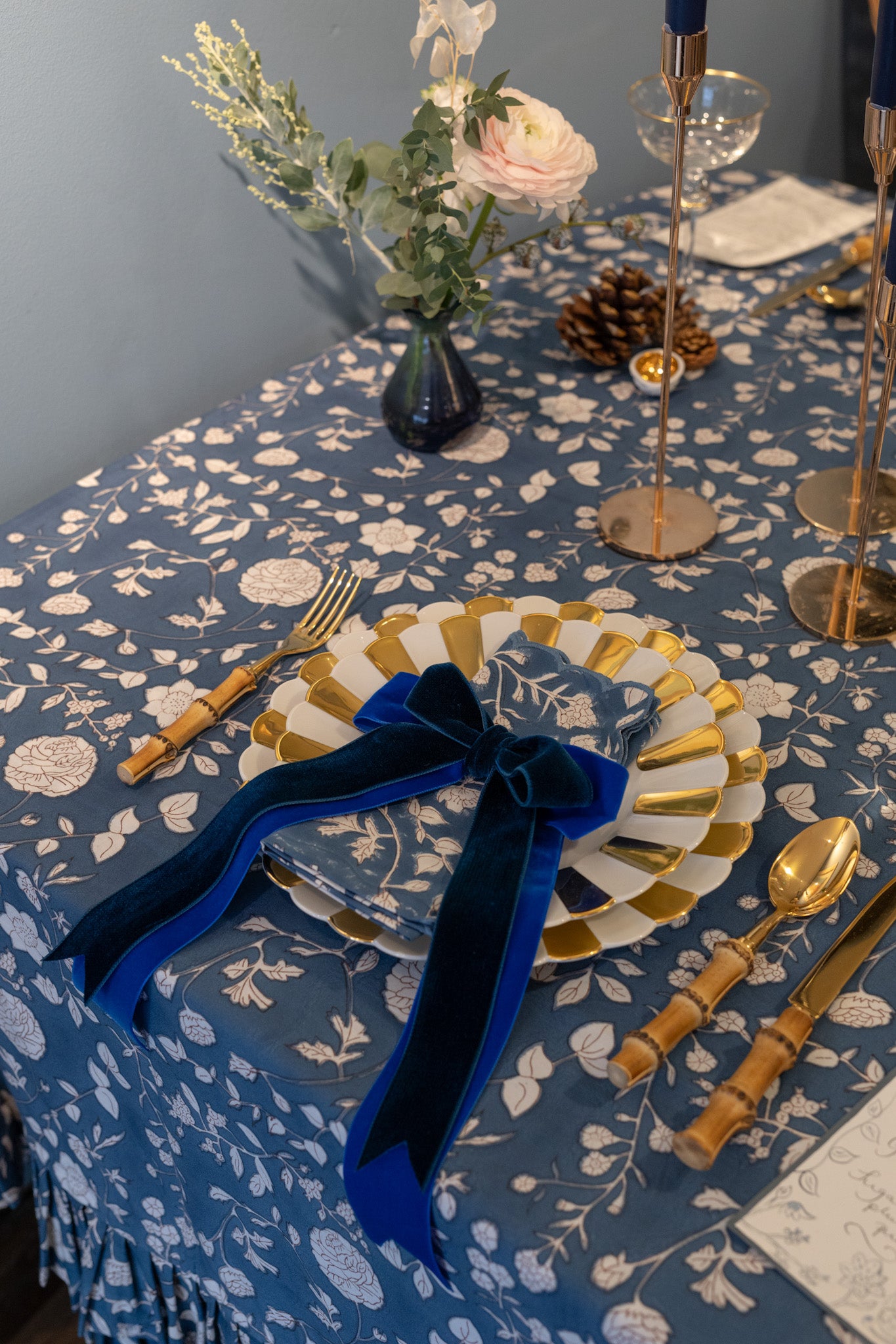 Blue tablescape by Rosanna Falconer at Edward Bulmer with double velvet bows.