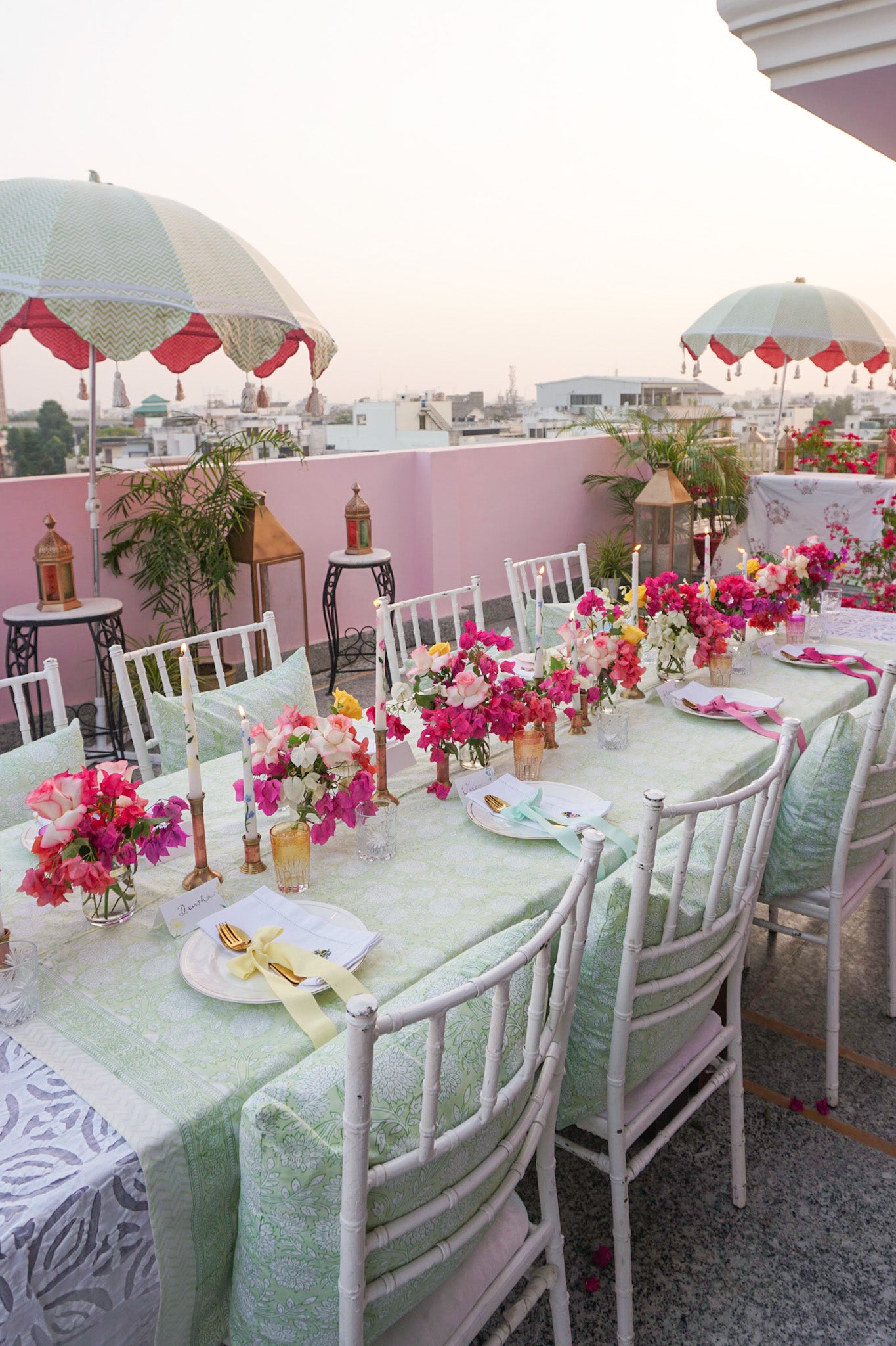Rosanna Falconer dinner party with green block printed tablecloth and cushions