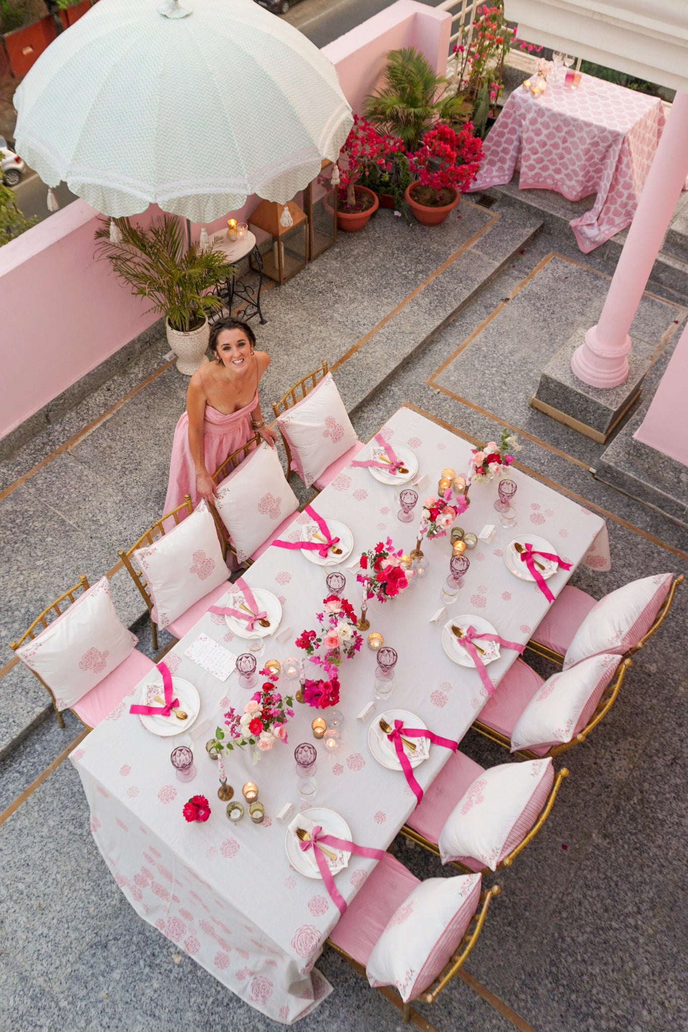 Aerial view of pink tablescape on pink terrace in Jaipur