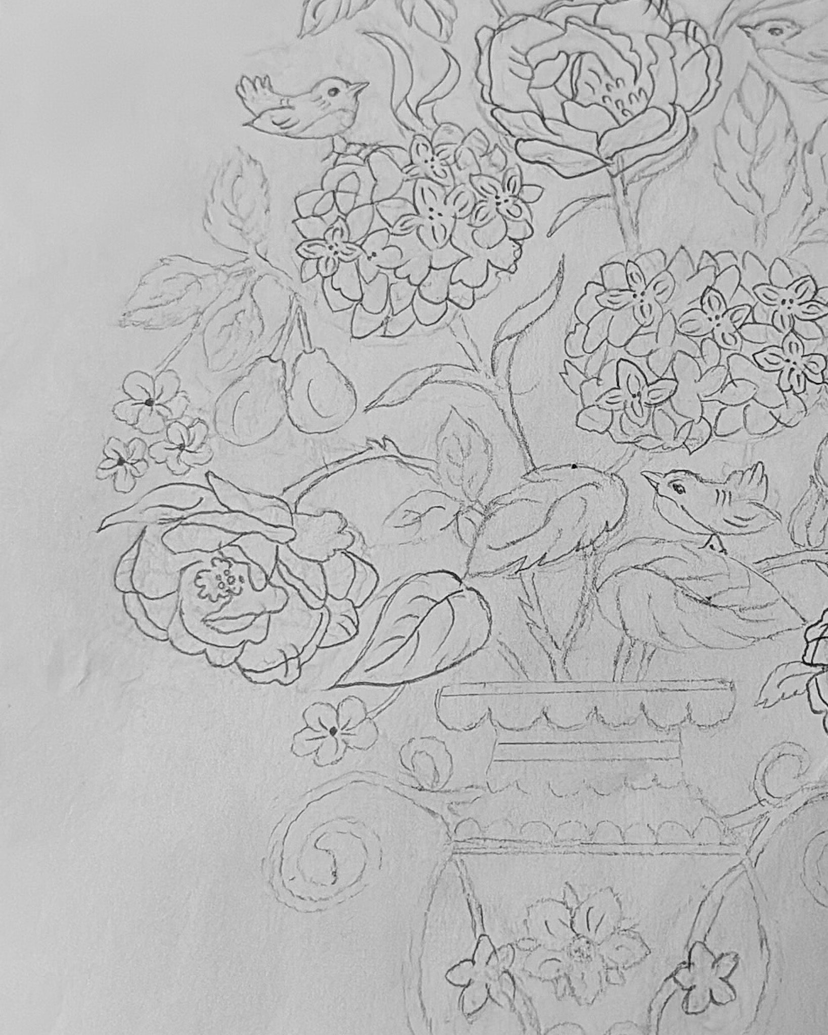 Decorative floral and bird pattern on a light gray background