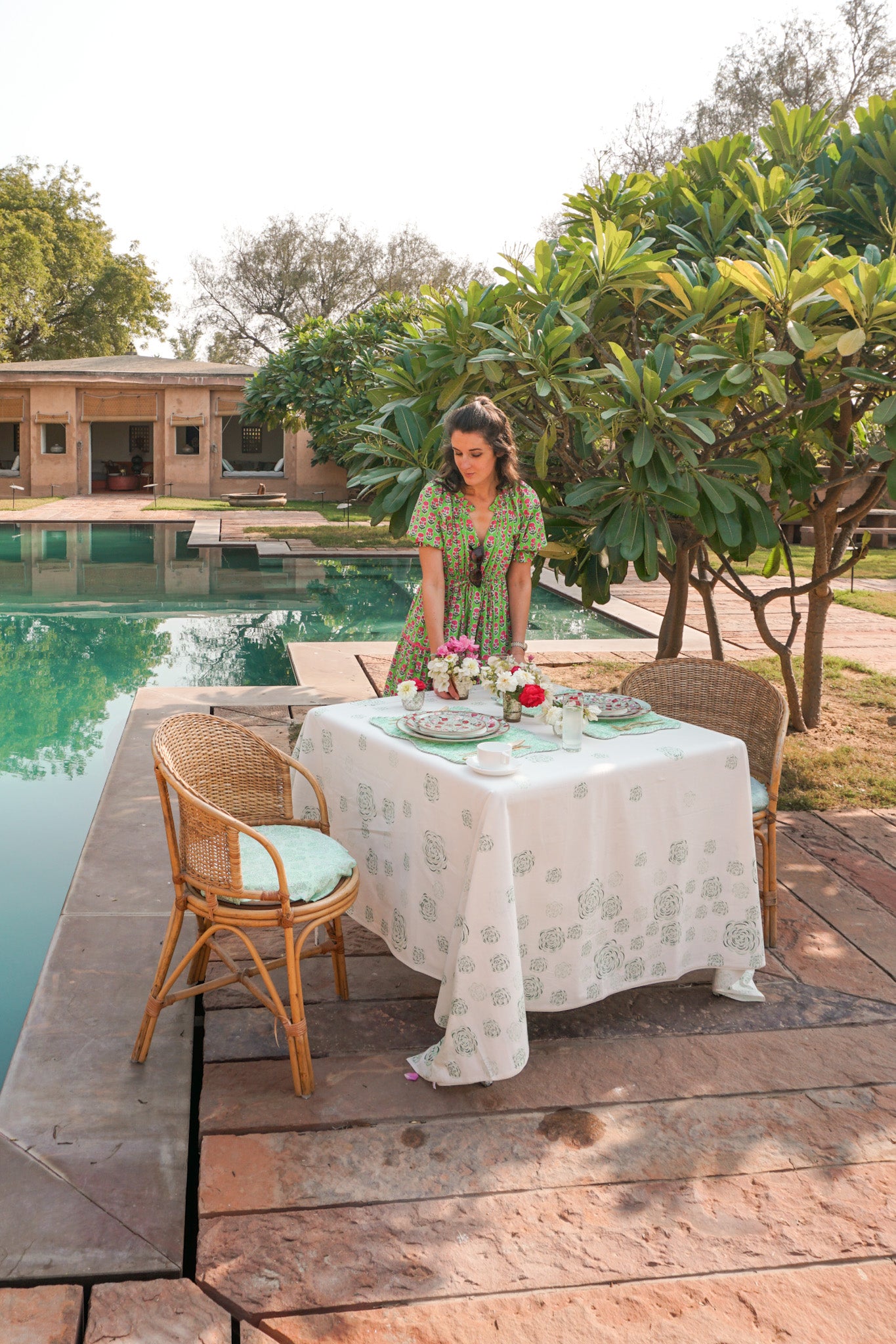 Deeppura Garh swimming pool with table laid for breakfast next to it